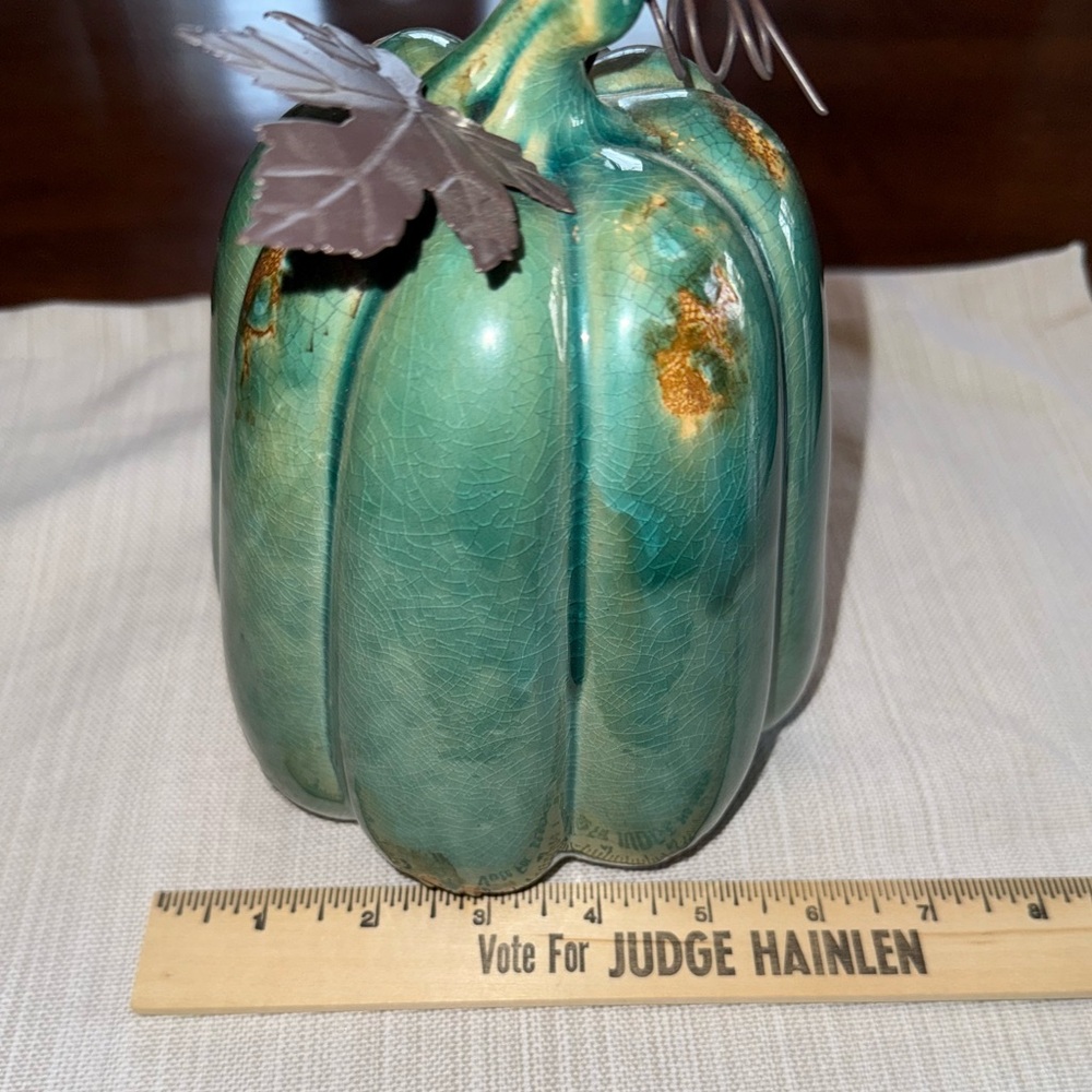 Ceramic pumpkin with metal leaf accent